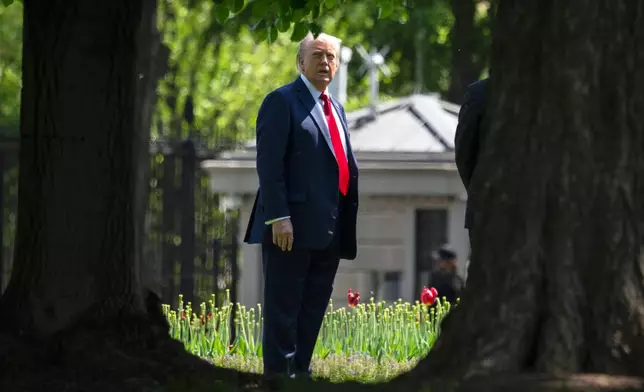 President Donald Trump stands on the North Lawn of the White House in Washington, Wednesday, April 23, 2025, in Washington. (AP Photo/Mark Schiefelbein)