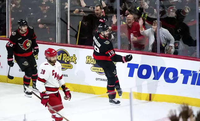 Ottawa Senators right wing Drake Batherson (19) celebrates after his goal against the Carolina Hurricanes during third-period NHL hockey game action in Ottawa, Ontario, Thursday, April 17, 2025. (Spencer Colby/The Canadian Press via AP)