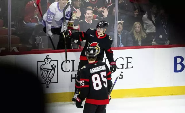 Ottawa Senators center Tim Stutzle (18) celebrates after his goal during third-period NHL hockey game action against the Carolina Hurricanes in Ottawa, Ontario, Thursday, April 17, 2025. (Spencer Colby/The Canadian Press via AP)
