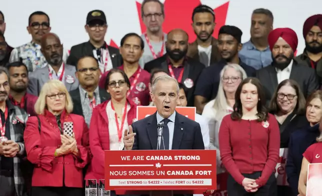 Canadian Prime Minister Mark Carney speaks to supporters on stage at his campaign headquarters after the Liberal Party won the Canadian election in Ottawa, Ontario, Tuesday, April 29, 2025. (Frank Gunn/The Canadian Press via AP)