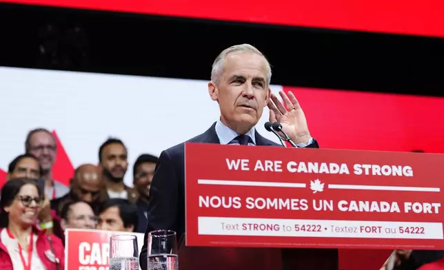 Canadian Prime Minister Mark Carney gestures as he speaks at his campaign headquarters after the Liberal Party won the Canadian election in Ottawa on Tuesday, April 29, 2025. (Justin Tang/The Canadian Press via AP)