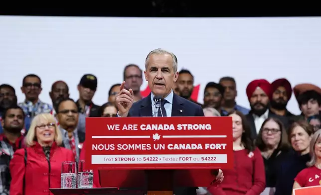 Canadian Prime Minister Mark Carney speaks to supporters on stage at his campaign headquarters after the Liberal Party won the Canadian election in Ottawa, Tuesday, April 29, 2025. (Justin Tang//The Canadian Press via AP)
