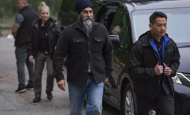 NDP Leader Jagmeet Singh arrives for a sign waving campaign event with Port Moody-Coquitlam NDP candidate Bonita Zarrillo and volunteers on election day, in Port Moody, British Columbia, Monday, April 28, 2025. (Darryl Dyck/The Canadian Press via AP)