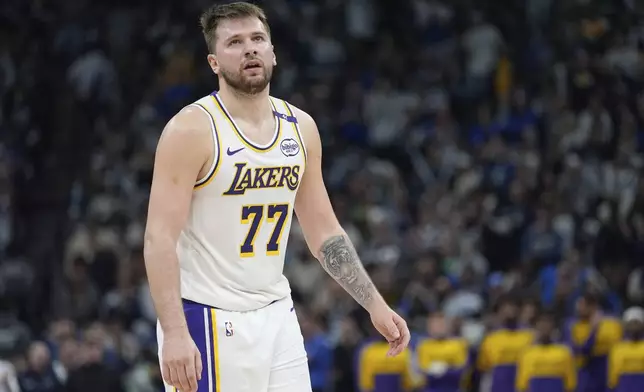 Los Angeles Lakers guard Luka Doncic (77) reacts after a foul called on the Lakers during the first half of Game 4 of an NBA basketball first-round playoff series against the Minnesota Timberwolves, Sunday, April 27, 2025, in Minneapolis. (AP Photo/Abbie Parr)