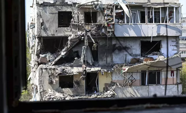 A multi-storey building is seen damaged by a Russian strike on residential neighbourhood in Zaporizhzhia, Ukraine, on Tuesday, April 22, 2025. (AP Photo/Kateryna Klochko)