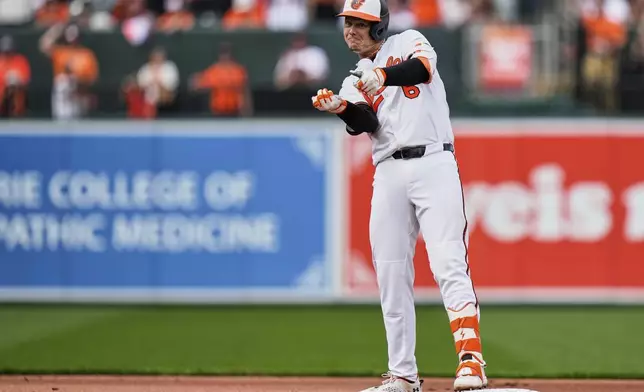 Baltimore Orioles' Ryan Mountcastle celebrates after advancing to second base on a fielding error by Boston Red Sox left fielder Jarren Duran after hitting a single during the first inning of an opening-day baseball game, Monday, March 31, 2025, in Baltimore. (AP Photo/Stephanie Scarbrough)