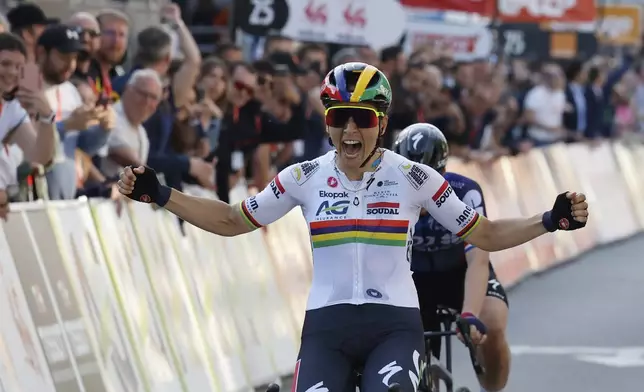 Mauritius' Kim Le Court de Billot of the AG Insurance Soudal team crosses the finish line to win the Belgian cycling classic and UCI World Tour race Liege Bastogne Liege, in Liege, Belgium, Sunday, April 27, 2025. (AP Photo/Geert Vanden Wijngaert)