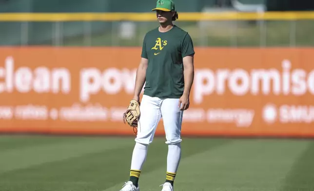 Athletics top prospect Nick Kurtz stands during warmups of a baseball game against the Texas Rangers Tuesday, April 22, 2025, in West Sacramento, Calif. (AP Photo/Scott Marshall)