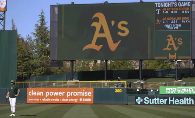 Athletics top prospect Nick Kurtz stands during warmups of a baseball game against the Texas Rangers Tuesday, April 22, 2025, in West Sacramento, Calif. (AP Photo/Scott Marshall)