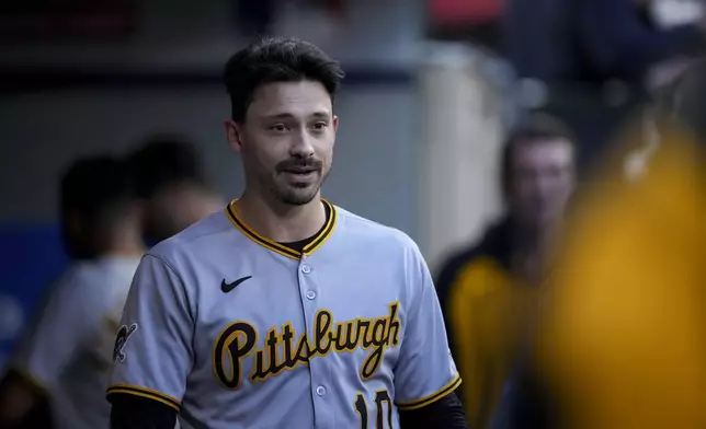 Pittsburgh Pirates outfielder Bryan Reynolds reacts in the dugout after hitting a sacrifice fly to score a runner during the third inning of a baseball game against the Los Angeles Angels Wednesday, April 23, 2025, in Anaheim, Calif. (AP Photo/Eric Thayer)