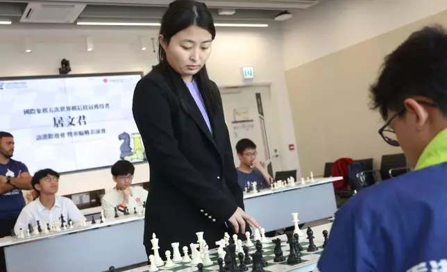 Five-Time World Champion, GM Ju Wenjun and Hong Kong Chess Players in Simultaneous Chess Exhibition .