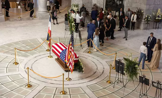 Attendees pay their respects during a funeral service for former U.S. Rep. Mia Love, Sunday, April 6, 2025, in Salt Lake City. (AP Photo/Melissa Majchrzak)