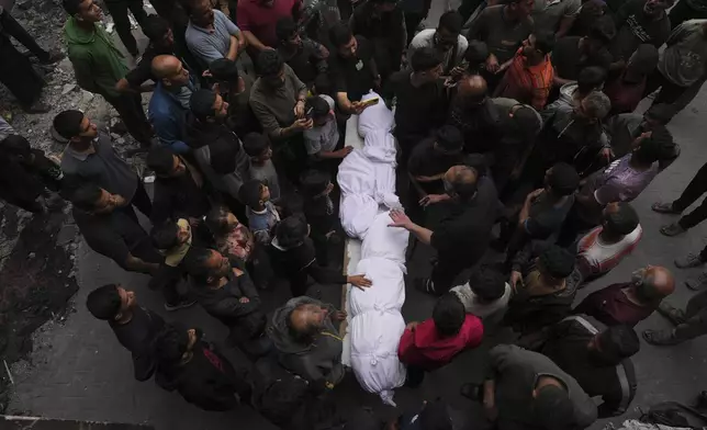 Palestinians bid farewell to their relatives who were killed in Israeli airstrikes early this morning on Yaffa School, in Gaza City, Wednesday, April 23, 2025. (AP Photo/Jehad Alshrafi)