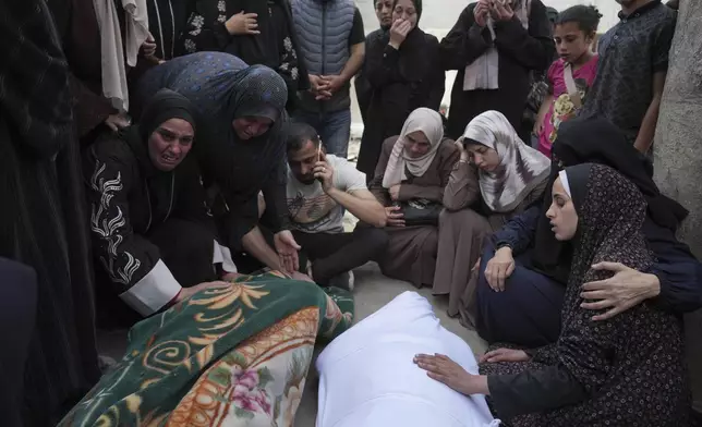 Palestinians bid farewell to their relatives who were killed in Israeli airstrikes early this morning on Yaffa School, in Gaza City, Wednesday, April 23, 2025. (AP Photo/Jehad Alshrafi)