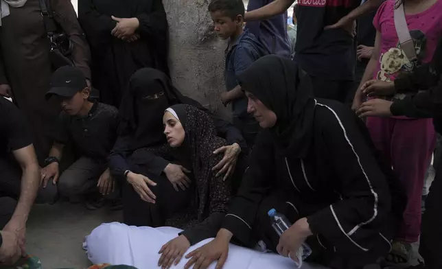 Palestinians bid farewell to their relatives who were killed in Israeli airstrikes early this morning on Yaffa School, in Gaza City, Wednesday, April 23, 2025. (AP Photo/Jehad Alshrafi)