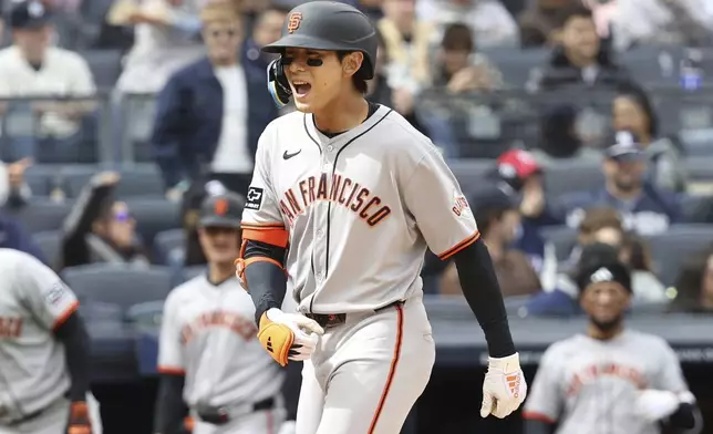 San Francisco Giants' Jung Hoo Lee reacts after hitting a three run home run during the sixth inning of a baseball game against the New York Yankees Sunday, April 13, 2025, in New York. (AP Photo/Pamela Smith)