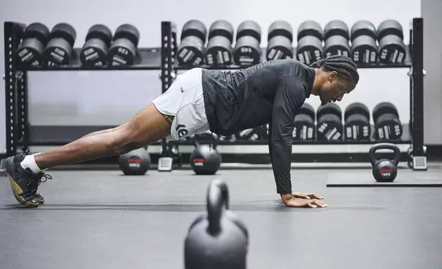 Wide receiver Tory Horton works out as he prepares for the NFL football draft at a gym in Irvine, Calif., on Friday, March 21, 2025. (AP Photo/Damian Dovarganes)