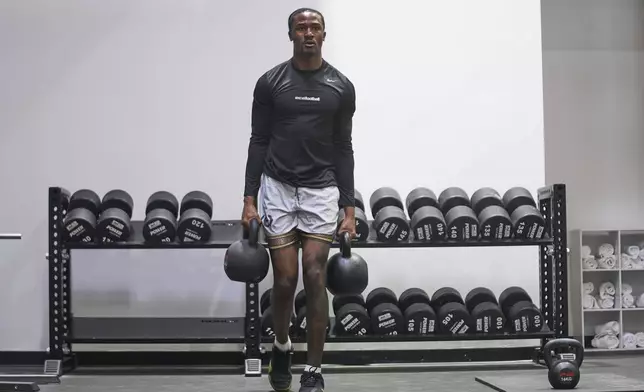 Wide receiver Tory Horton works out as he prepares for the NFL football draft at a gym in Irvine, Calif., on Friday, March 21, 2025. (AP Photo/Damian Dovarganes)