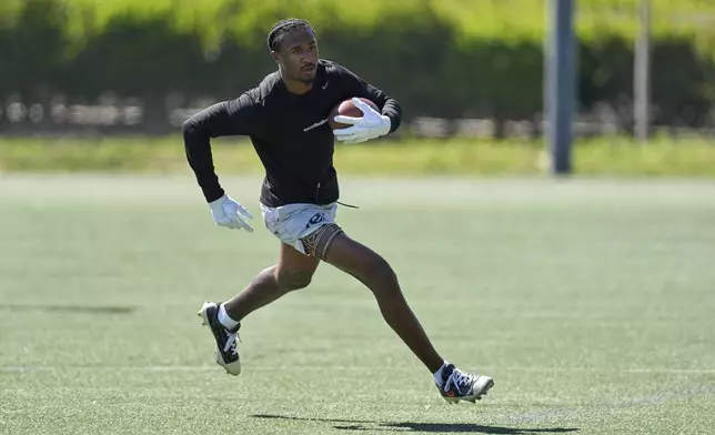 Wide receiver Tory Horton trains for the NFL football draft at Lake Forest Sports Park in Lake Forest, Calif., on Friday, March 21, 2025. (AP Photo/Damian Dovarganes)