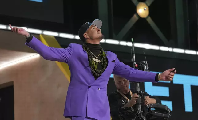 Arizona wide receiver Tetairoa McMillan celebrates after being chosen by the Carolina Panthers with the eighth overall pick during the first round of the NFL football draft, Thursday, April 24, 2025, in Green Bay, Wis. (AP Photo/Jeff Roberson)