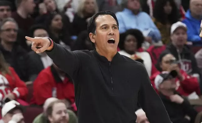 Miami Heat head coach Erik Spoelstra gives direction during the first half of an NBA play-in tournament basketball game against the Chicago Bulls in Chicago, Wednesday, April 16, 2025. (AP Photo/Nam Y. Huh)