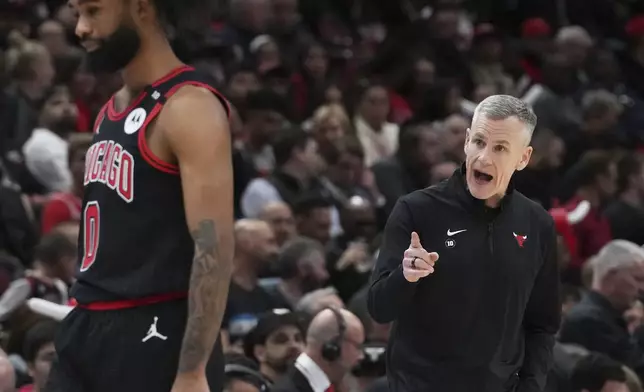 Chicago Bulls head coach Billy Donovan, right, points as he talks to guard Coby White during the first half of an NBA play-in tournament basketball game against the Miami Heat in Chicago, Wednesday, April 16, 2025. (AP Photo/Nam Y. Huh)