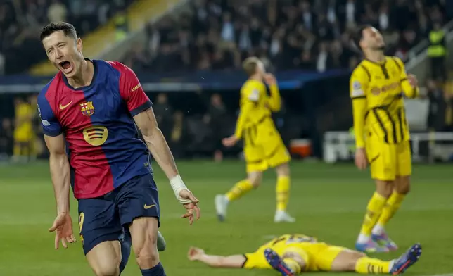 Barcelona's Robert Lewandowski celebrates after scoring his side's third goal during the Champions League quarterfinals first leg soccer match between Barcelona and Borussia Dortmund, at the Lluis Companys Olympic stadium in Barcelona, Spain, Wednesday, April 9, 2025. (AP Photo/Joan Monfort)