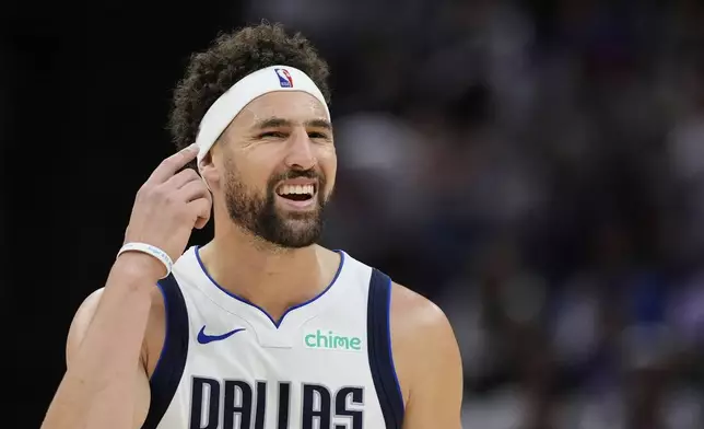 Dallas Mavericks guard Klay Thompson gestures to the crowd during the second half of an NBA play-in tournament basketball game against the Sacramento Kings, Wednesday, April 16, 2025, in Sacramento, Calif. (AP Photo/Godofredo A. Vásquez)