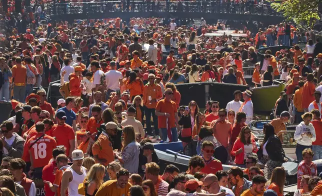 People celebrate King's Day in Amsterdam, Netherlands, Saturday, April 26, 2025. (AP Photo/Peter Dejong)