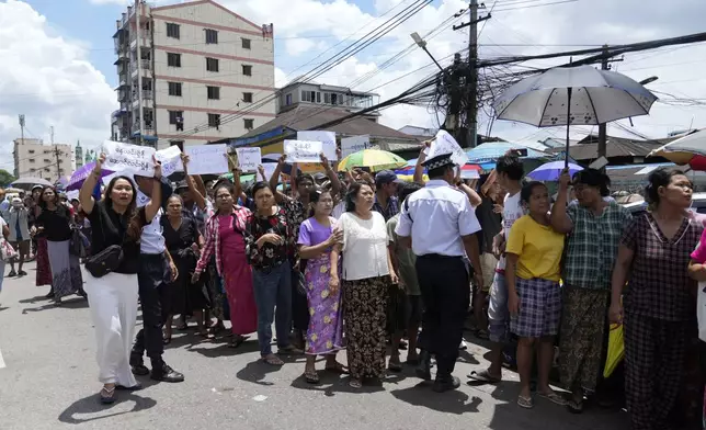 Family members and colleagues wait to welcome released prisoners outside the main gate of Insein prison as the head of Myanmar’s military government granted amnesty to thousands of prisoners to mark the country's traditional New Year Thursday, April 17, 2025, in Yangon, Myanmar. (AP Photo/Thein Zaw)