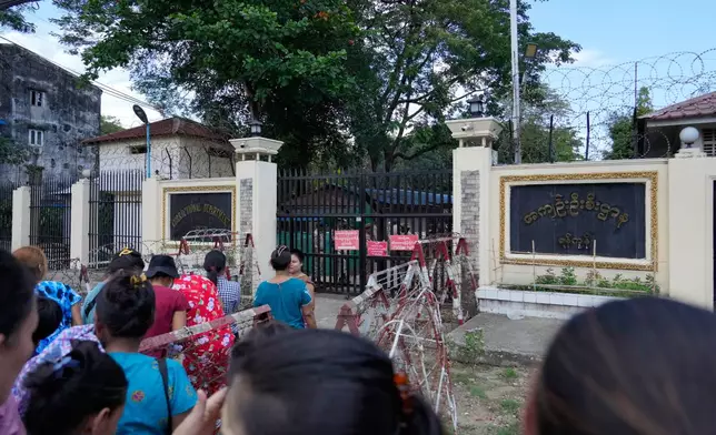 Family members and colleagues wait to welcome released prisoners outside the main gate of Insein prison as the head of Myanmar’s military government granted amnesty to thousands of prisoners to mark the country's traditional New Year Thursday, April 17, 2025, in Yangon, Myanmar. (AP Photo/Thein Zaw)