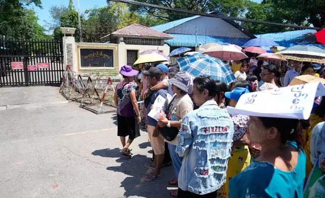Family members and colleagues wait to welcome released prisoners outside the main gate of Insein prison as the head of Myanmar’s military government granted amnesty to thousands of prisoners to mark the country's traditional New Year Thursday, April 17, 2025, in Yangon, Myanmar. (AP Photo/Thein Zaw)