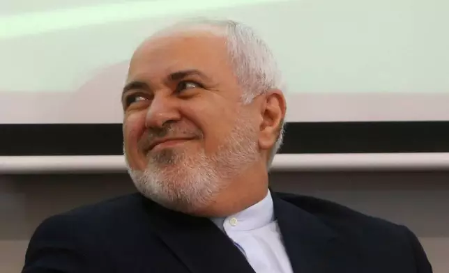 FILE - Iran's Foreign Minister Mohammad Zarif smiles during a meeting with students on a climate change forum at the Gabriel René Moreno Autonomous University, in Santa Cruz Bolivia, on July 23, 2019. (AP Photo/Juan Karita, File)