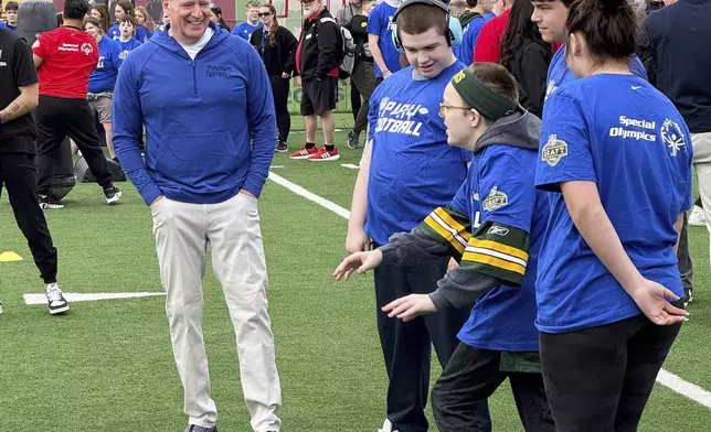 NFL Commissioner Roger Goodell encourages athletes from the Special Olympics at the league’s flag football clinic outside Lambeau Field, Wednesday, April 23, 2025, in Green Bay, Wis. (AP Photo/Rob Maaddi)