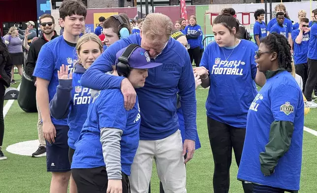 NFL Commissioner Roger Goodell encourages athletes from the Special Olympics at the league’s flag football clinic outside Lambeau Field, Wednesday, April 23, 2025, in Green Bay, Wis. (AP Photo/Rob Maaddi)