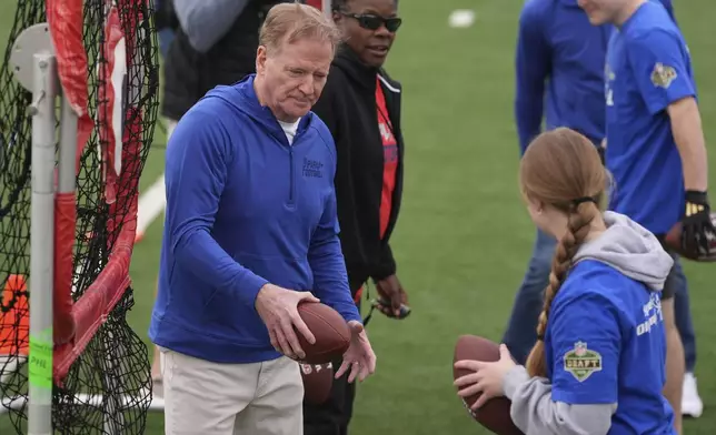 NFL Commissioner Roger Goodell works with local youth football players and Special Olympics athletes during the league's annual prospect clinic ahead of the NFL football draft Wednesday, April 23, 2025, in Green Bay, Wis. (AP Photo/Jeff Roberson)