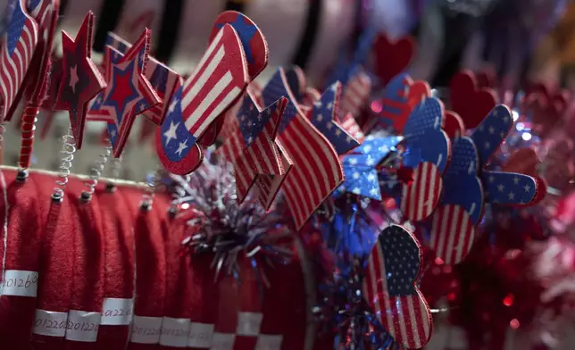 U.S. flag themed wearables are displayed at the Yiwu International Trade Market in Yiwu, eastern China's Zhejiang province, Thursday, April 10, 2025. (AP Photo/Ng Han Guan)