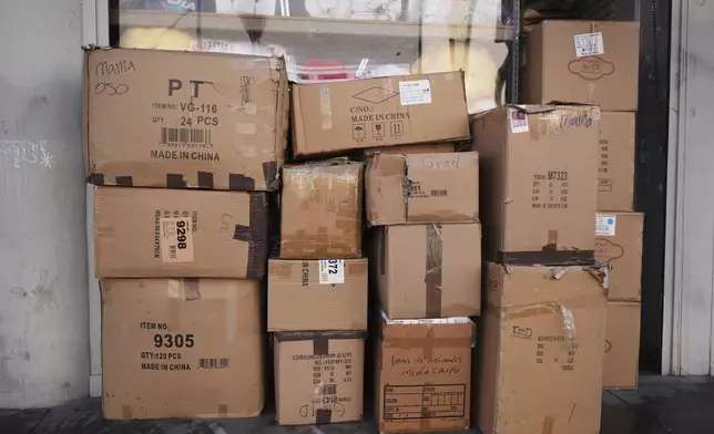 Boxes of party supplies imported from China are stacked outside a store in the Toy District of Los Angeles, Wednesday, April 9, 2025. (AP Photo/Jae C. Hong)