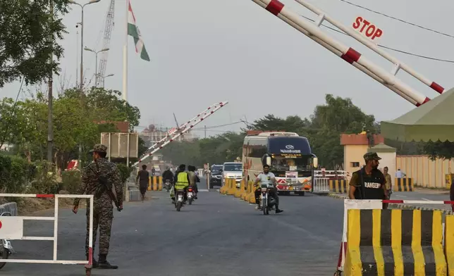 Pakistan's paramilitary soldiers stand guard at a checkpoint near Wahag, a joint border crossing point between the Pakistan and India border, Thursday, April 24, 2025.(AP Photo/K.M. Chaudary)