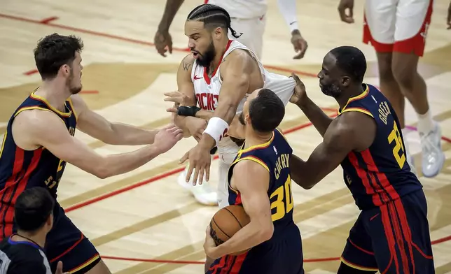 Houston Rockets' Dillon Brooks gets in a shoving match with Golden State Warriors players during the first half in Game 4 of an NBA basketball first-round playoff series in San Francisco, on Monday, April 28, 2025. (Carlos Avila Gonzalez/San Francisco Chronicle via AP)