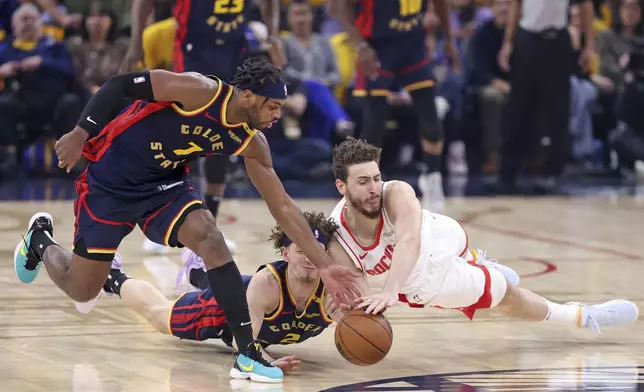 Golden State Warriors' Brandin Podziemski and Buddy Hield team up to control loose ball against Houston Rockets' Alperen Sengun in the first half of an NBA Playoffs' First Round Game 4 at Chase Center in San Francisco on Monday, April 28, 2025.(Scott Strazzante/San Francisco Chronicle via AP)