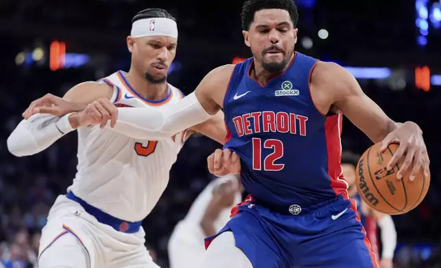 Detroit Pistons forward Tobias Harris (12), right, attempts to dribble past New York Knicks guard Josh Hart (3), left, during the second half of Game 1 in an NBA basketball first-round playoff series, Saturday, April 19, 2025, in New York. (AP Photo/Julia Demaree Nikhinson)