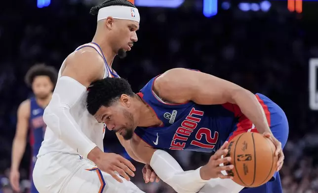 Detroit Pistons forward Tobias Harris (12), right, attempts to dribble past New York Knicks guard Josh Hart (3), left, during the second half of Game 1 in an NBA basketball first-round playoff series, Saturday, April 19, 2025, in New York. (AP Photo/Julia Demaree Nikhinson)