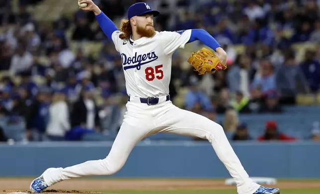 Los Angeles Dodgers' Dustin May throws against the Atlanta Braves during the first inning of a baseball game Tuesday, April 1, 2025, in Los Angeles. (AP Photo/Kevork Djansezian)