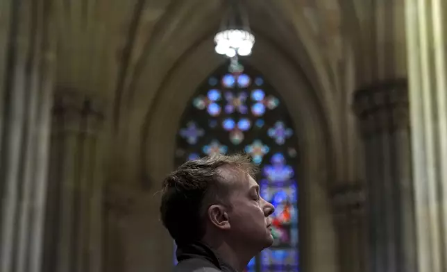 A parishioner prays during a memorial mass for the late Pope Francis at St. Patrick's Cathedral, Saturday, April 26, 2025, in New York. (AP Photo/Julia Demaree Nikhinson)