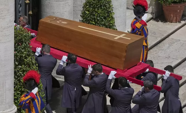 The coffin of Pope Francis is carried inside St. Mary Major Basilica for his burial ceremony, in Rome, Saturday, April 26, 2025. (AP Photo/Antonietta Baldassarre)