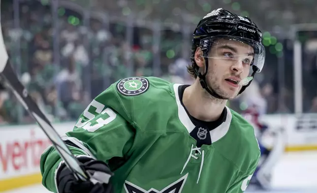 Dallas Stars center Wyatt Johnston skates after scoring during the first period of Game 5 of a first-round NHL hockey playoff series against the Colorado Avalanche in Dallas, Monday, April 28, 2025. (AP Photo/Gareth Patterson)