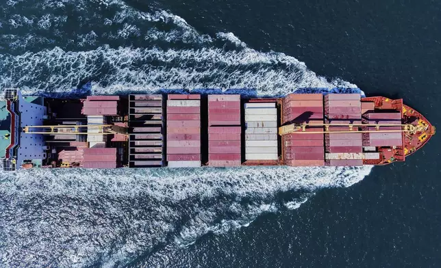 A container ship sails off from a container terminal in Qingdao in eastern China's Shandong province Sunday, April 6, 2025. (Chinatopix Via AP)