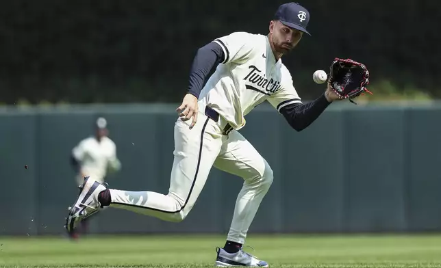 Minnesota Twins second baseman Edouard Julien (47) fields a groundout hit by Detroit Tigers' Trey Sweeney during the fifth inning of a baseball game Sunday, April 13, 2025, in Minneapolis. (AP Photo/Matt Krohn)