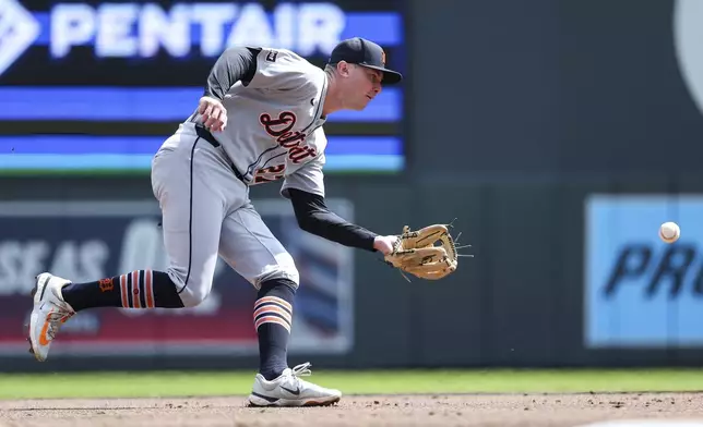 Detroit Tigers shortstop Trey Sweeney fields a groundout hit by Minnesota Twins' Ryan Jeffers during the second inning of a baseball game Sunday, April 13, 2025, in Minneapolis. (AP Photo/Matt Krohn)